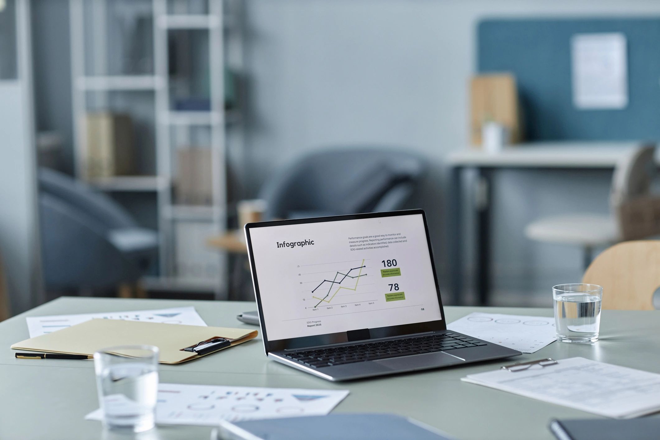 Laptop with financial charts on a modern office desk